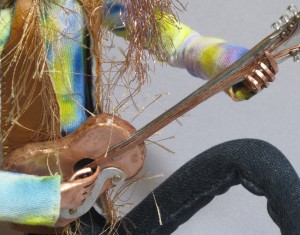 spoon handled guitar and hands from Janice doll