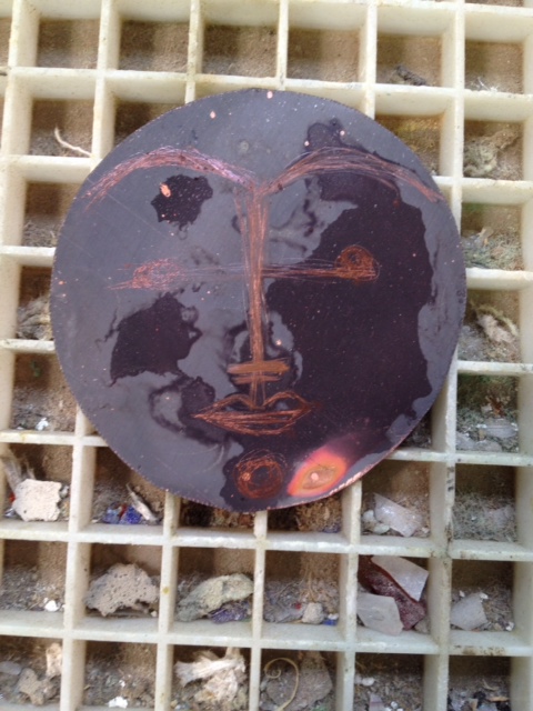 annealed copper disk with face outline