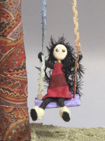 figure from "Folk Art on a Swing"