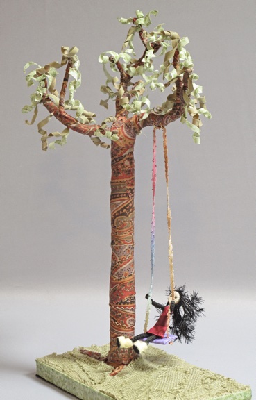 "Folk Art on a Swing" fabric ache over wire and wood
