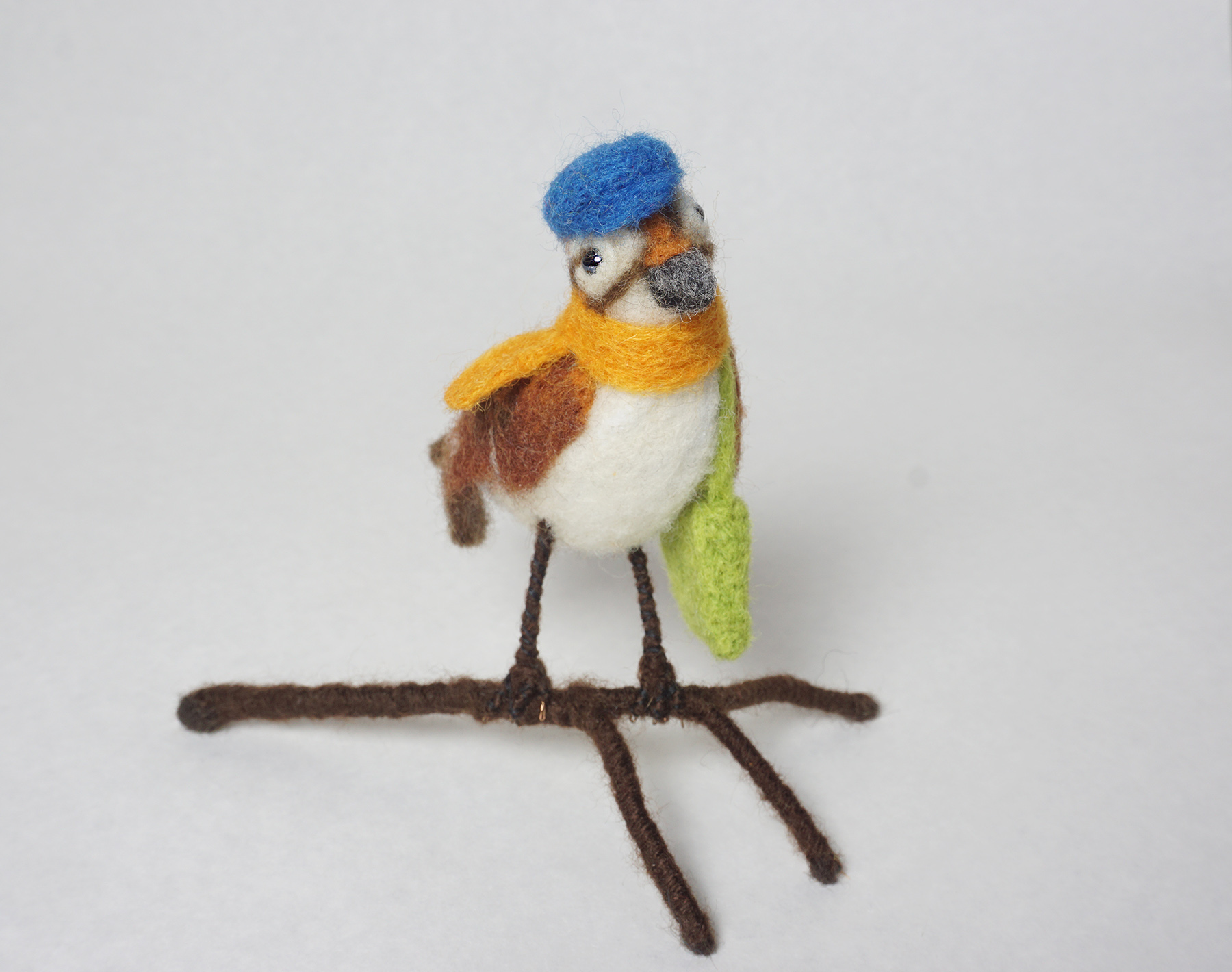 "Journey" anthropomorphic needle felted traveling sparrow sculpture