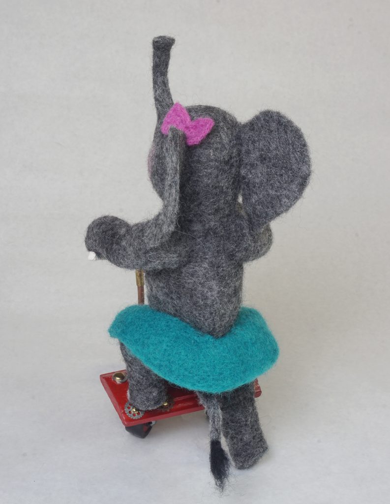 "Roll" - anthropomorphic elephant art doll sculpture on handcrafted steampunk push tricycle. Needle felted wool figure.