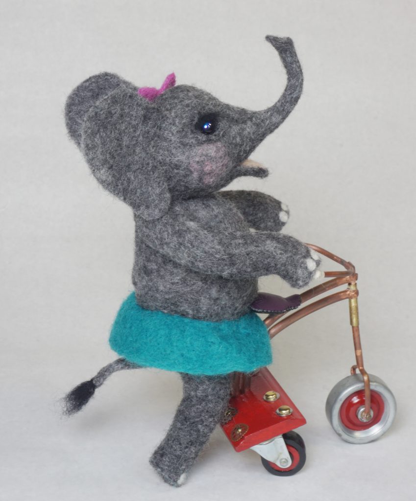 "Roll" anthropomorphic elephant art doll sculpture on handcrafted steampunk push tricycle. Needle felted wool figure.