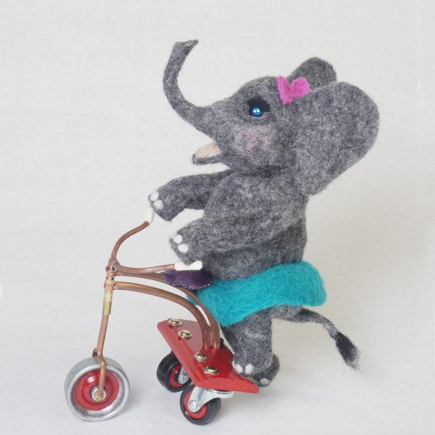 "Roll" anthropomorphic elephant art doll sculpture on handcrafted steampunk push tricycle. Needle felted wool figure.