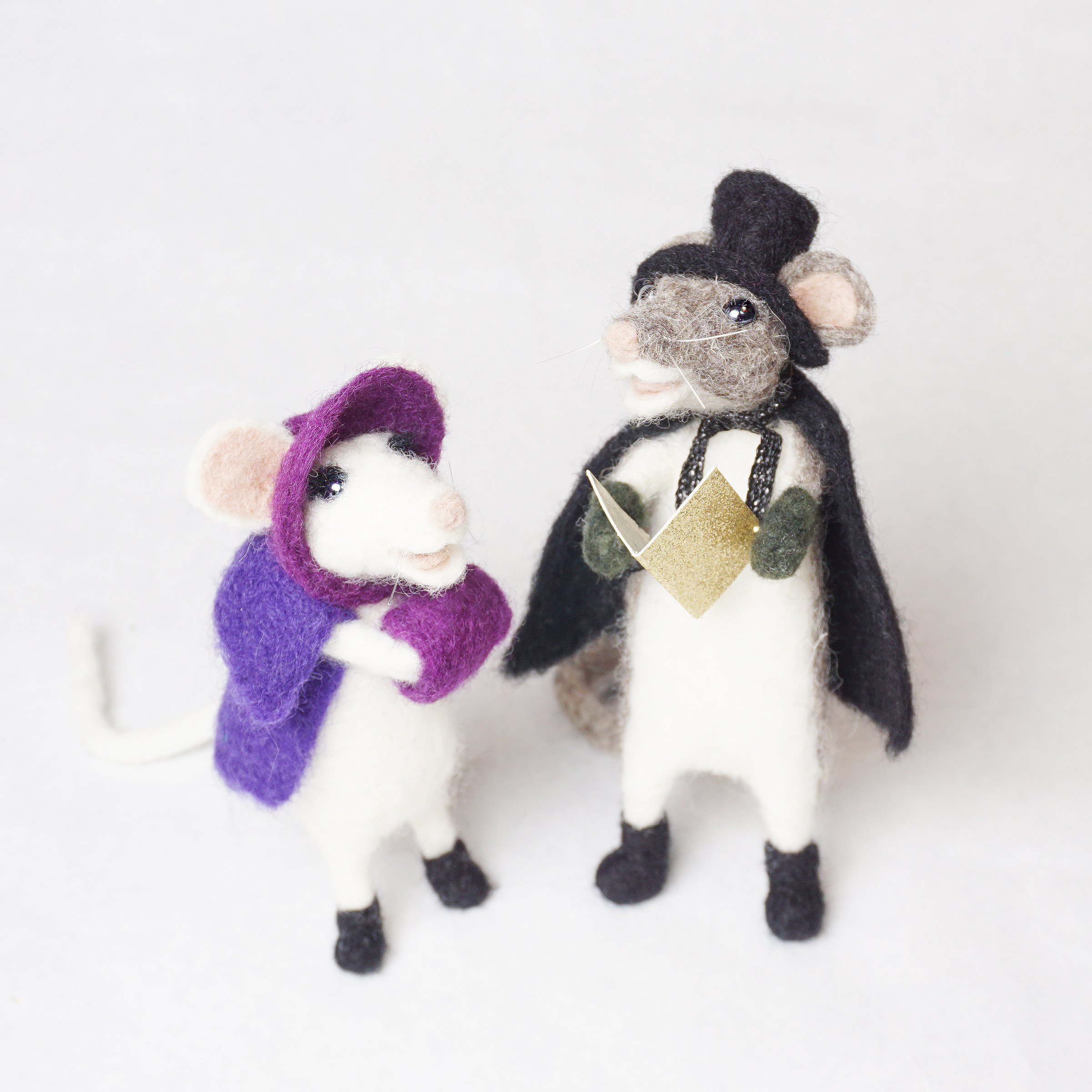 Pair of carol singing mice in victorian costume.