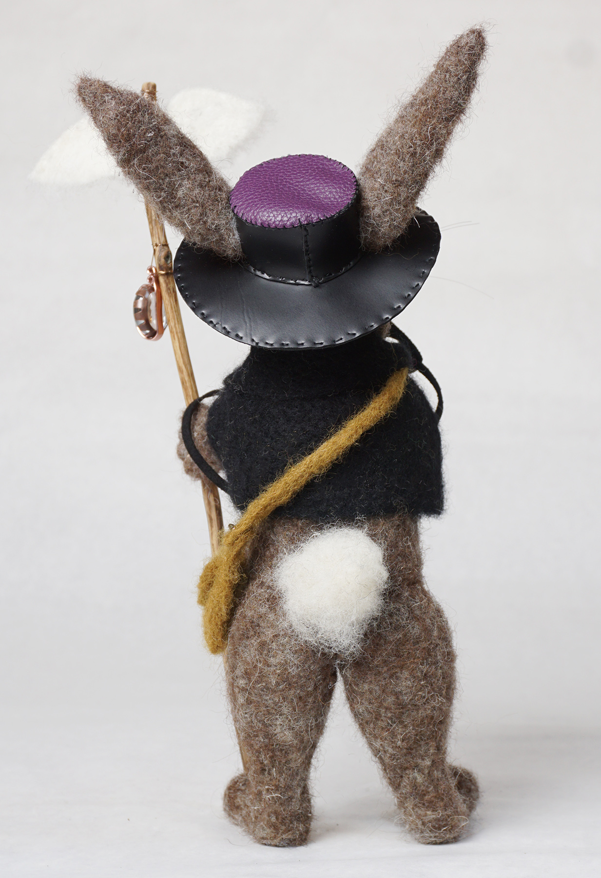 What's Up Doc is an anthropomorphic rabbit plague doctor art doll sculpture. Needle felted wool over wire and batting armature, glass bead, faux leather and suede embellishment.