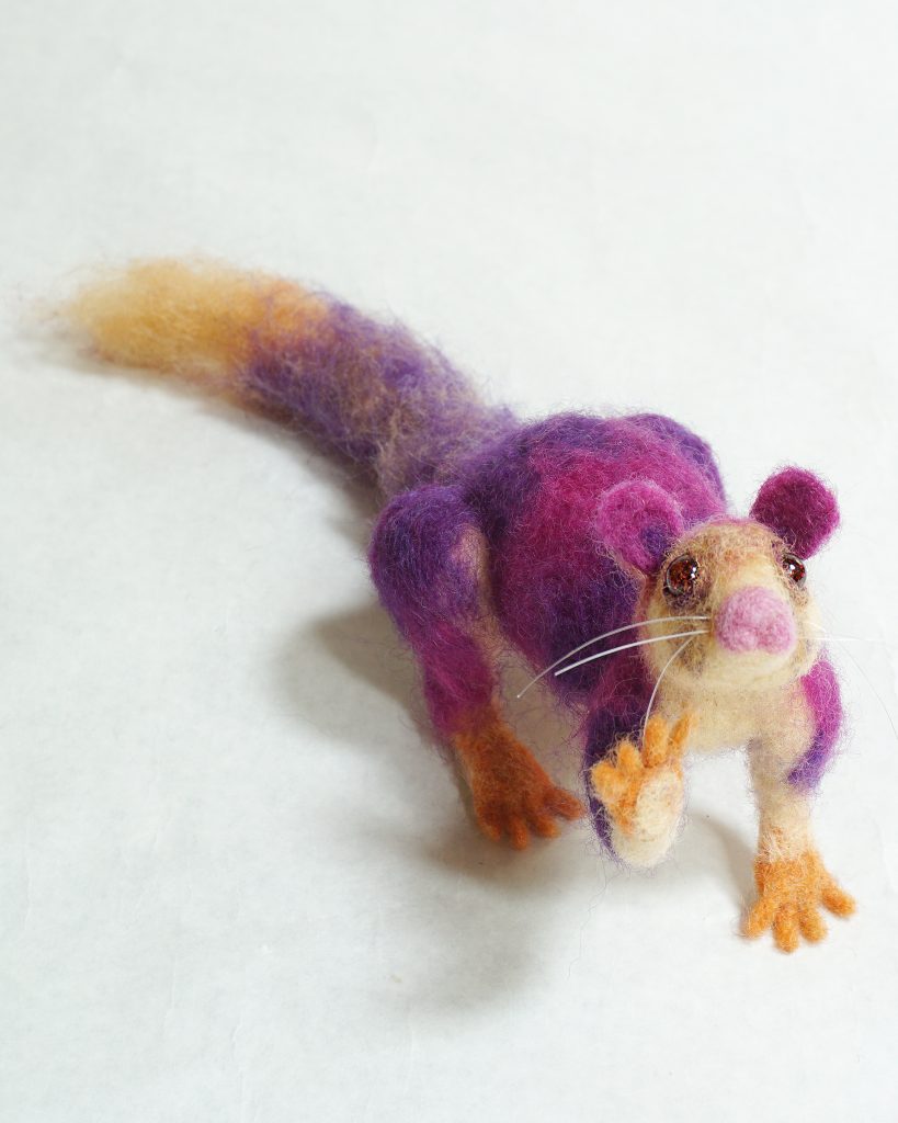 Waving anthropomorphic Malabar Giant Squirrel (Ratufa indica). Needle felted wool over wire and batting armature