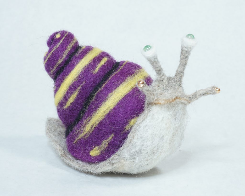 Needle felted snail sculpture based on imagery pulled from Virginia Wolfe short story Kew Gardens