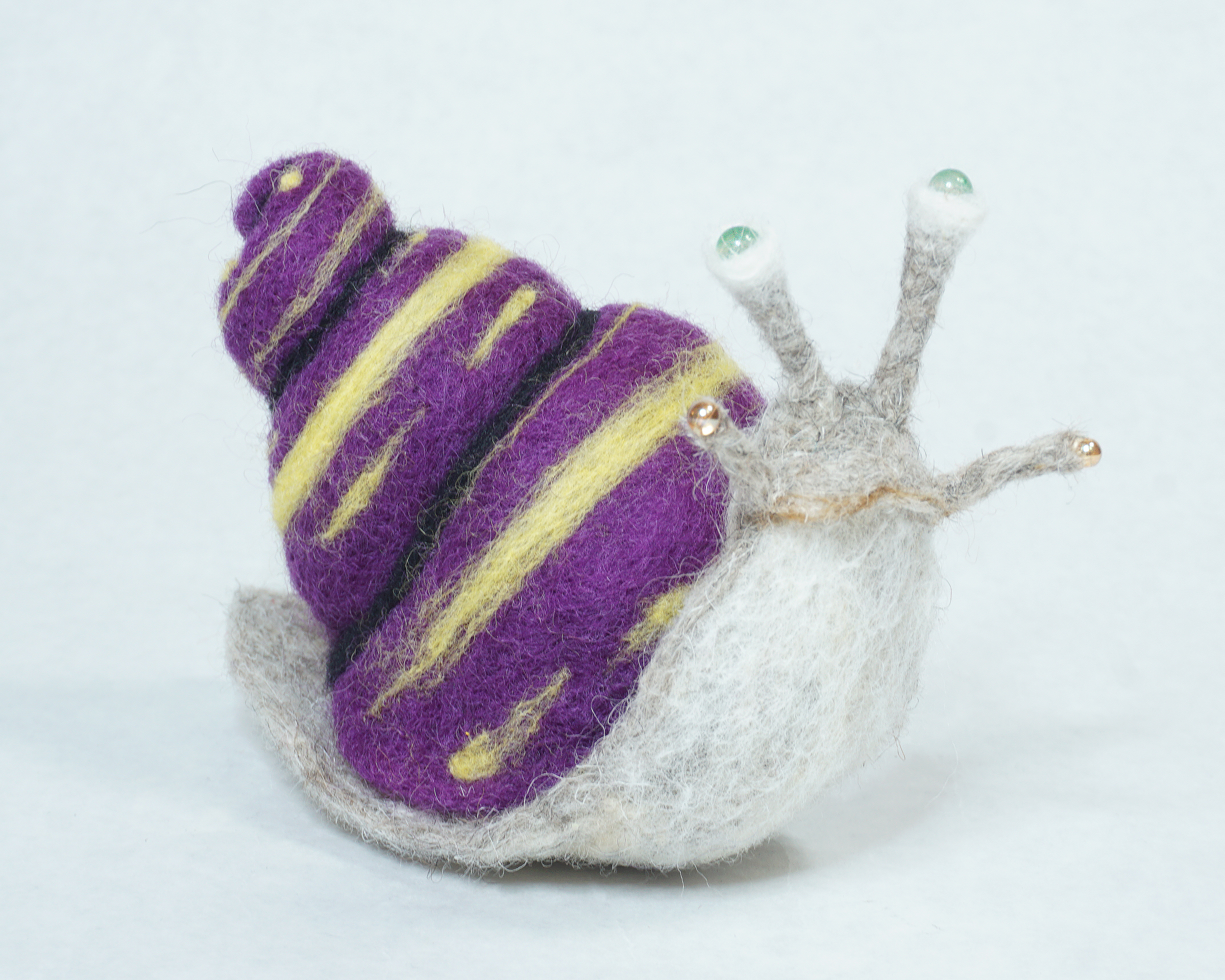 Needle felted snail art doll figure sculpture based on imagery pulled from Virginia Wolfe short story Kew Gardens