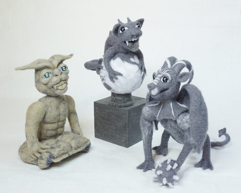 Needle felted gargoyle figure sculptures serve as protection against ilness, ignorance, and environmental destruction
