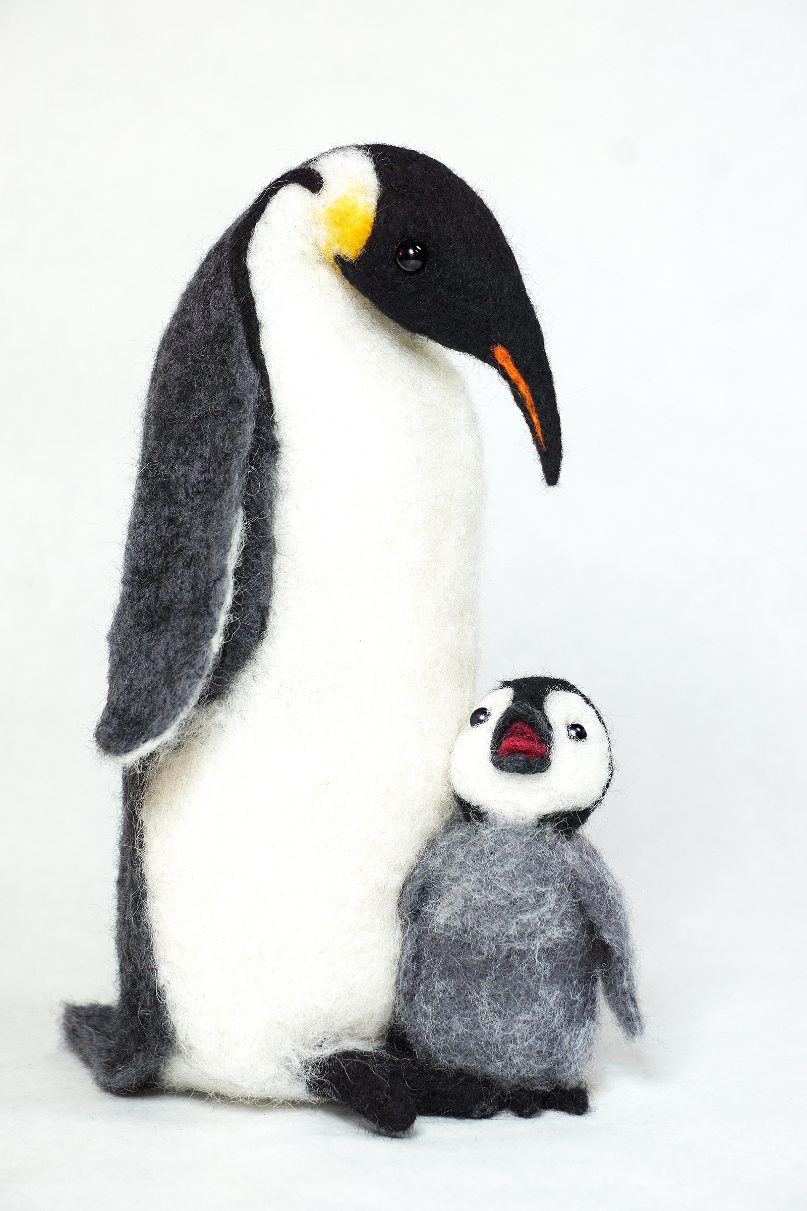 So Many Questions is an anthropomorphic penguin and chick art doll figure sculpture. Needle felted wool over wire and quilt batting armature