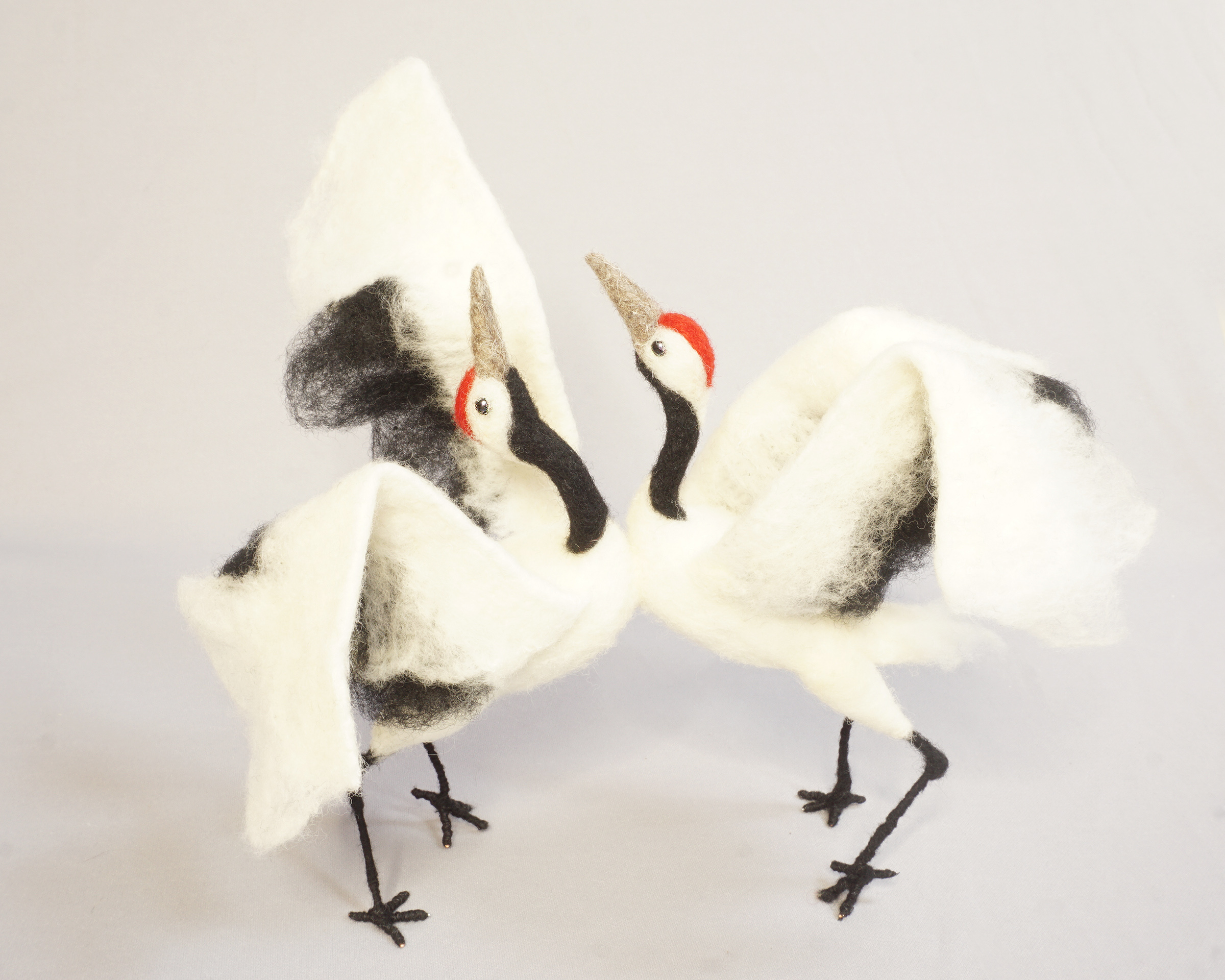 Anthropomorphic pair of dancing Japanese cranes. needle felted wool art doll figure sculpture