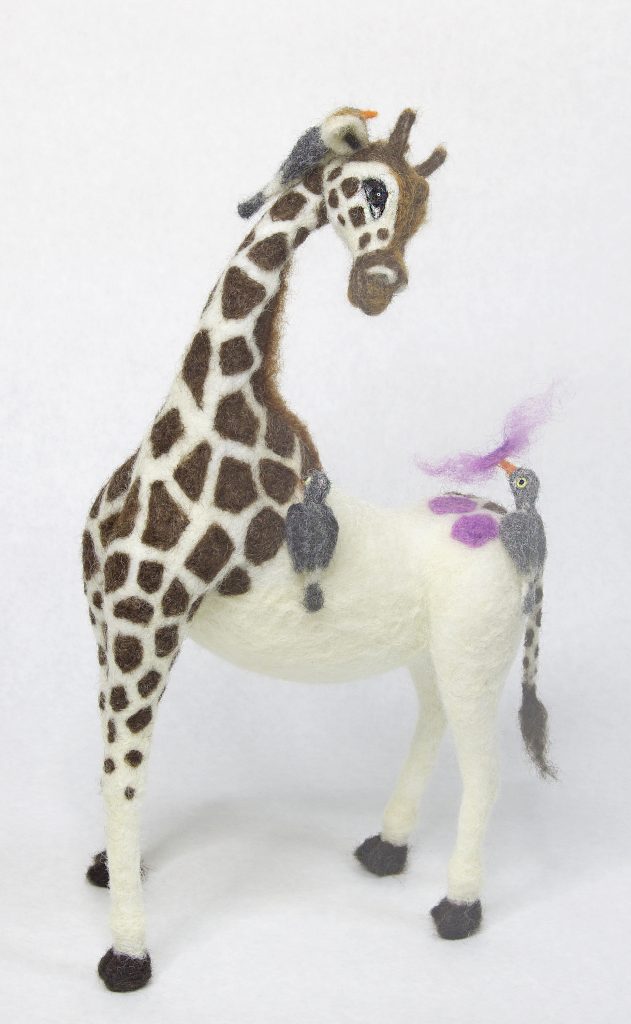 needle felted anthropomorphic giraffe sculpture with ox pecker birds and color surprise