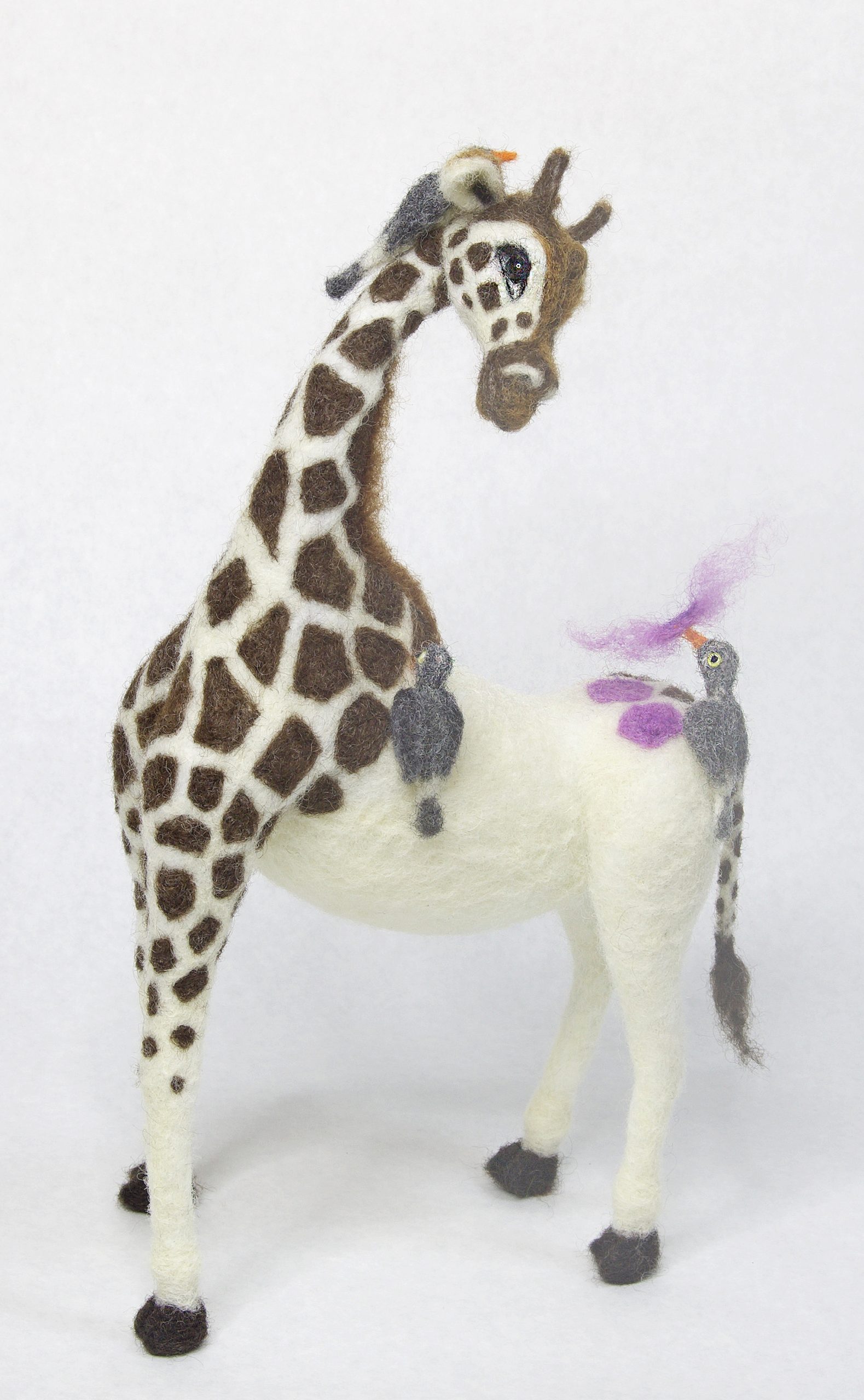 needle felted anthropomorphic giraffe sculpture with ox pecker birds and color surprise bling