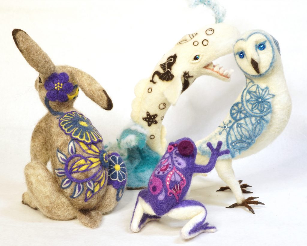 needle felted anthropomorphic animal figure sculptures with patterned surfaces