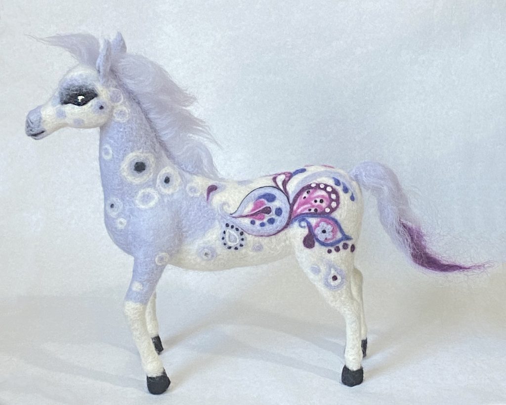 Horse sculpture, needle felted wool over wire and batting armature- grey appaloosa coat becomes colorful paisley pony. Iridescent glass bead eyes